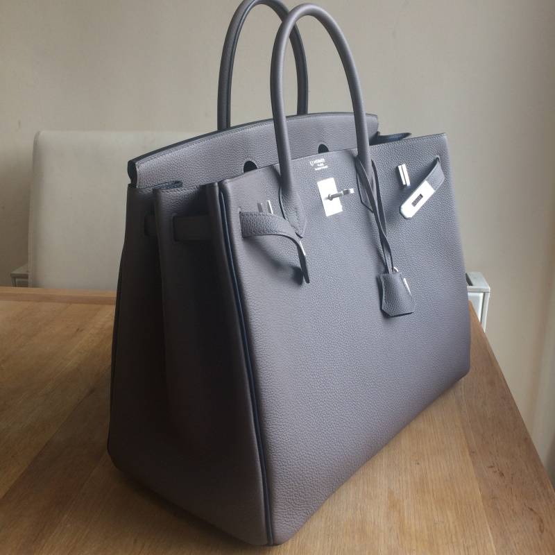 Hyper Bag Spa - HBS - Pictured is a Hermes Constance in Box Leather with a  visible mark / damage running down its front. Following a service at HBS,  involving specialist colour