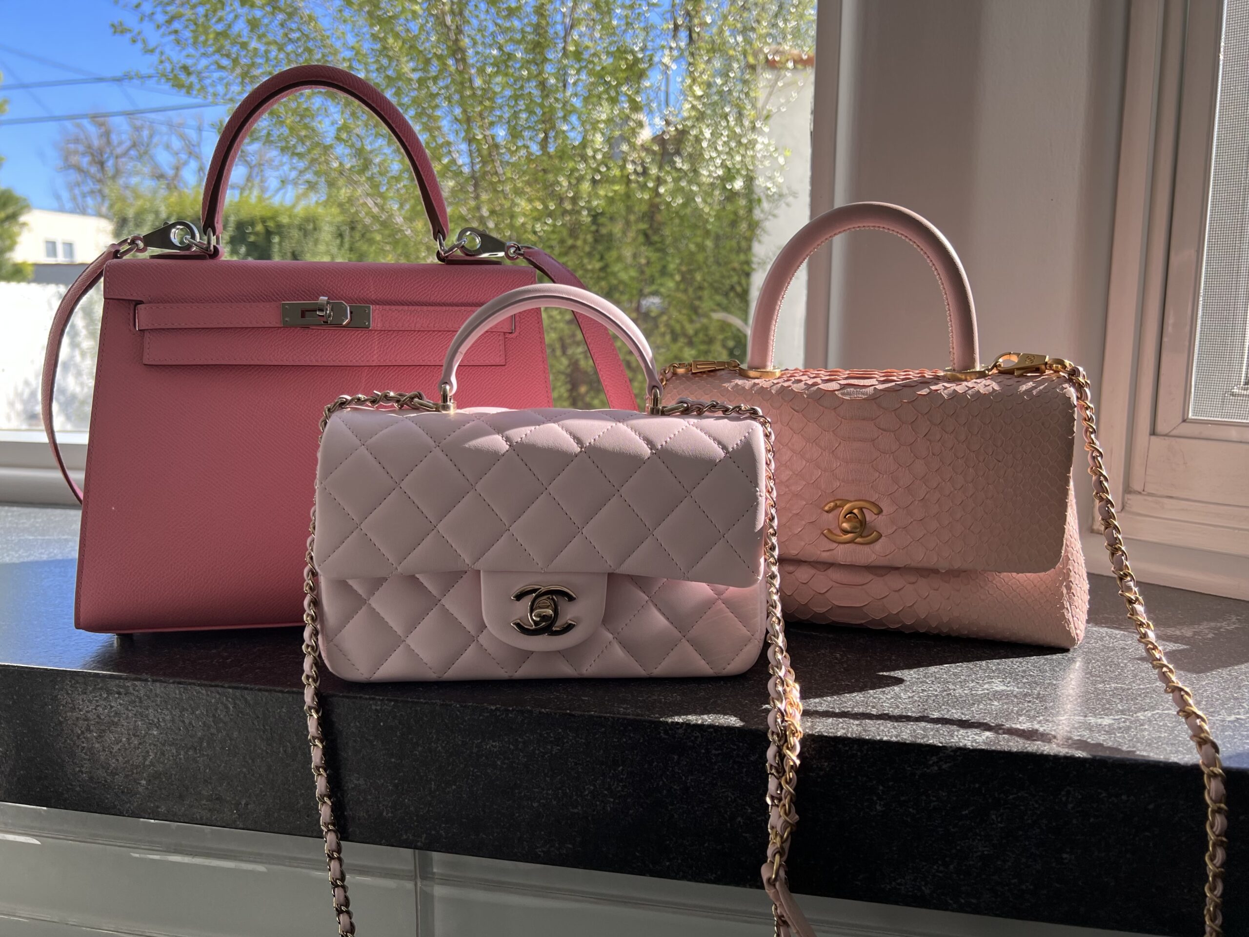 Chanel 23P Pink Mini Classic Flap with handle and a special (accidenta